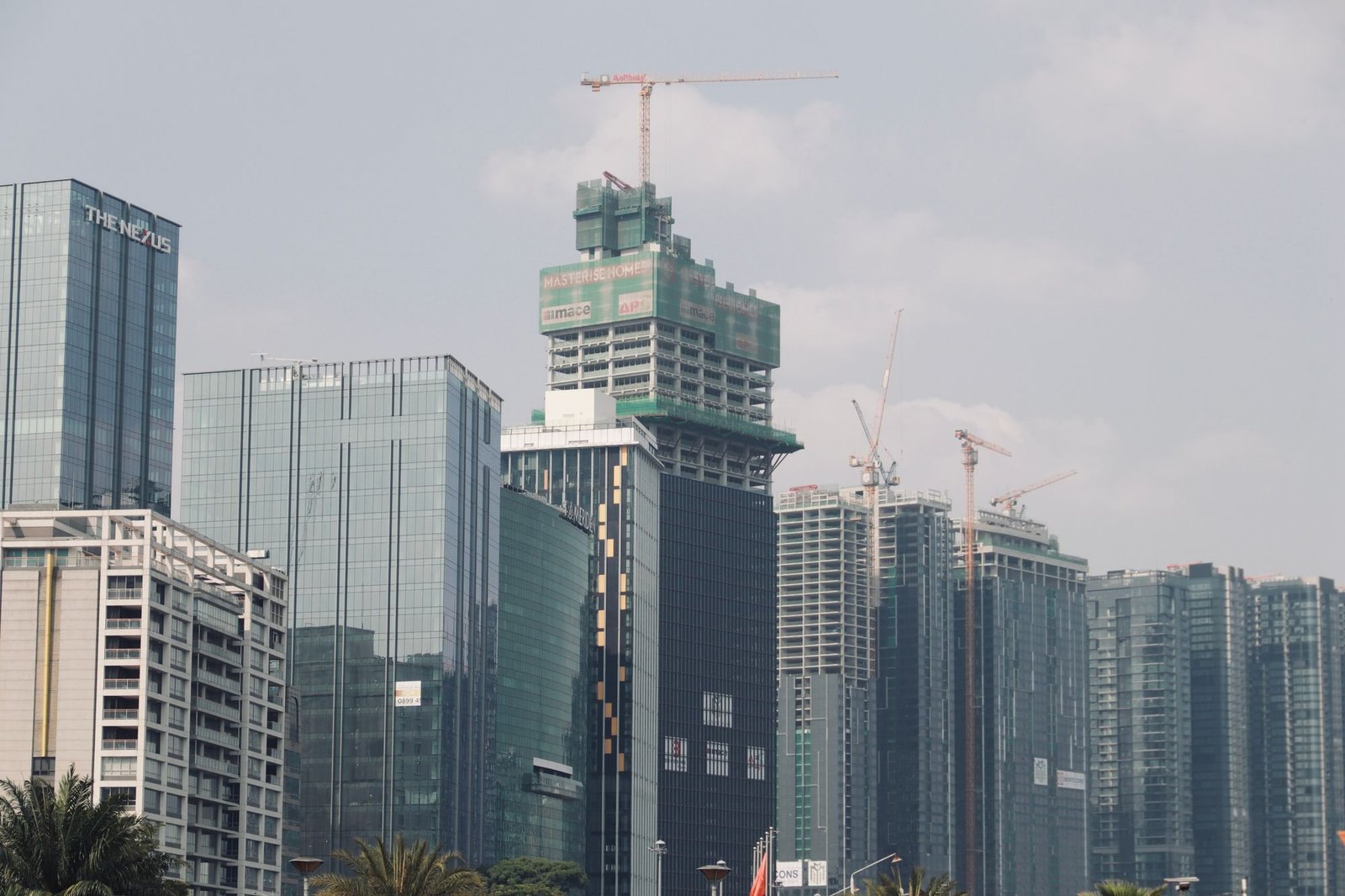 High-rise buildings under construction with tower cranes