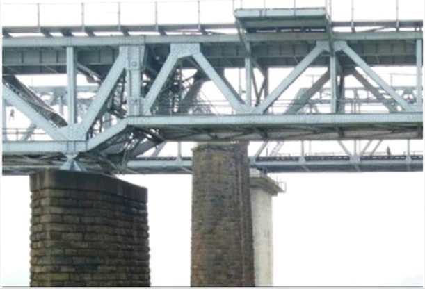 Steel truss railway bridge on masonry piers