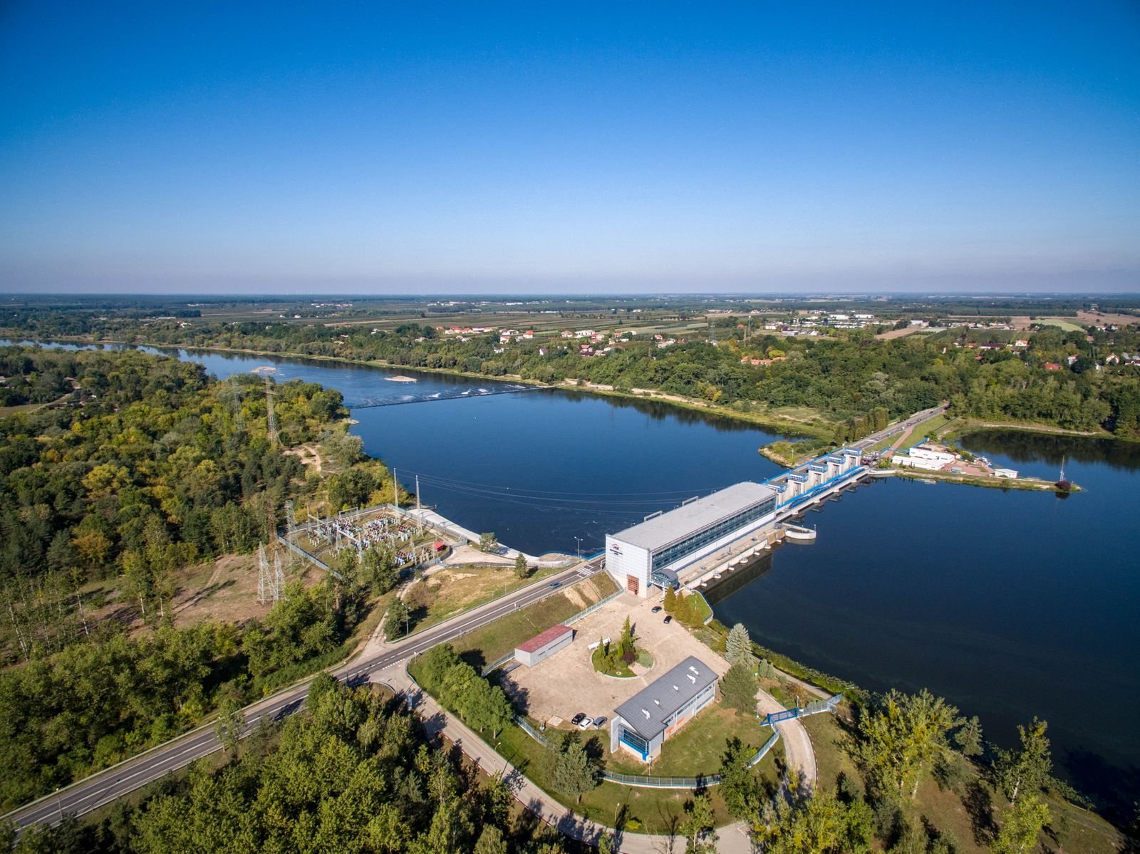 A river barrage and reservoir seen from above